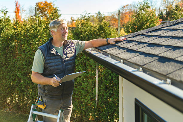 Professional Roof Replacement technician working in Amazonia, MO